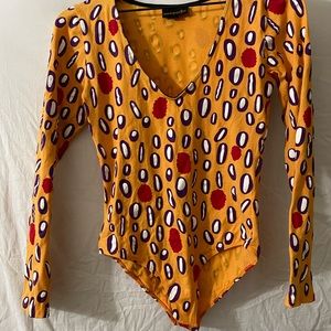 Noo works “raspberry” print bodysuit